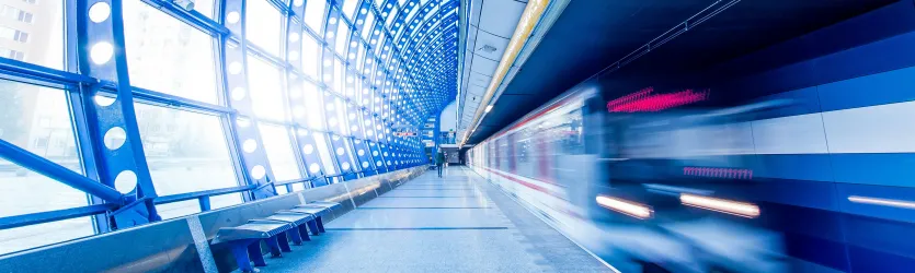 Subway Train Arrives At Metro Station in Motion